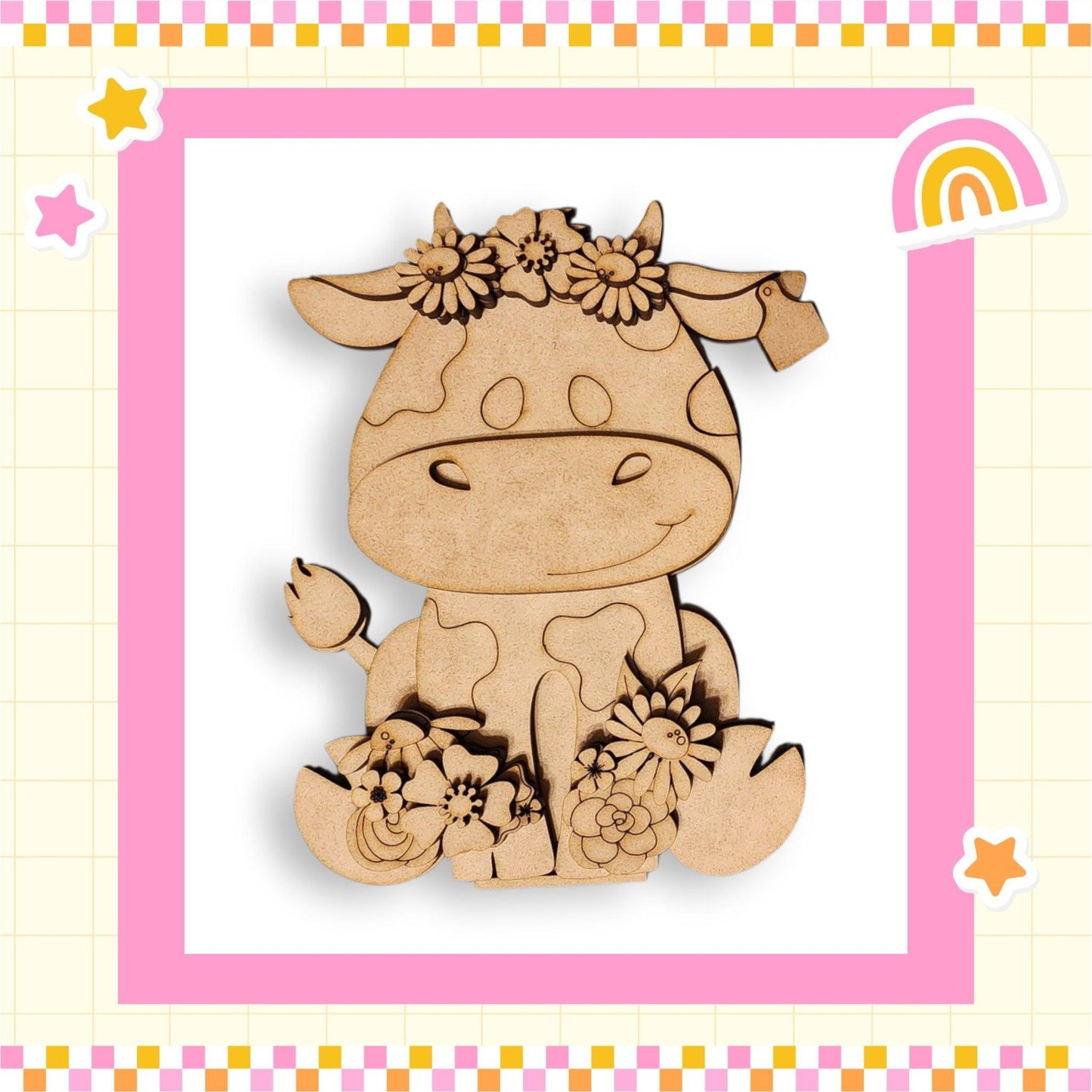 a wooden cutout of a cow with flowers