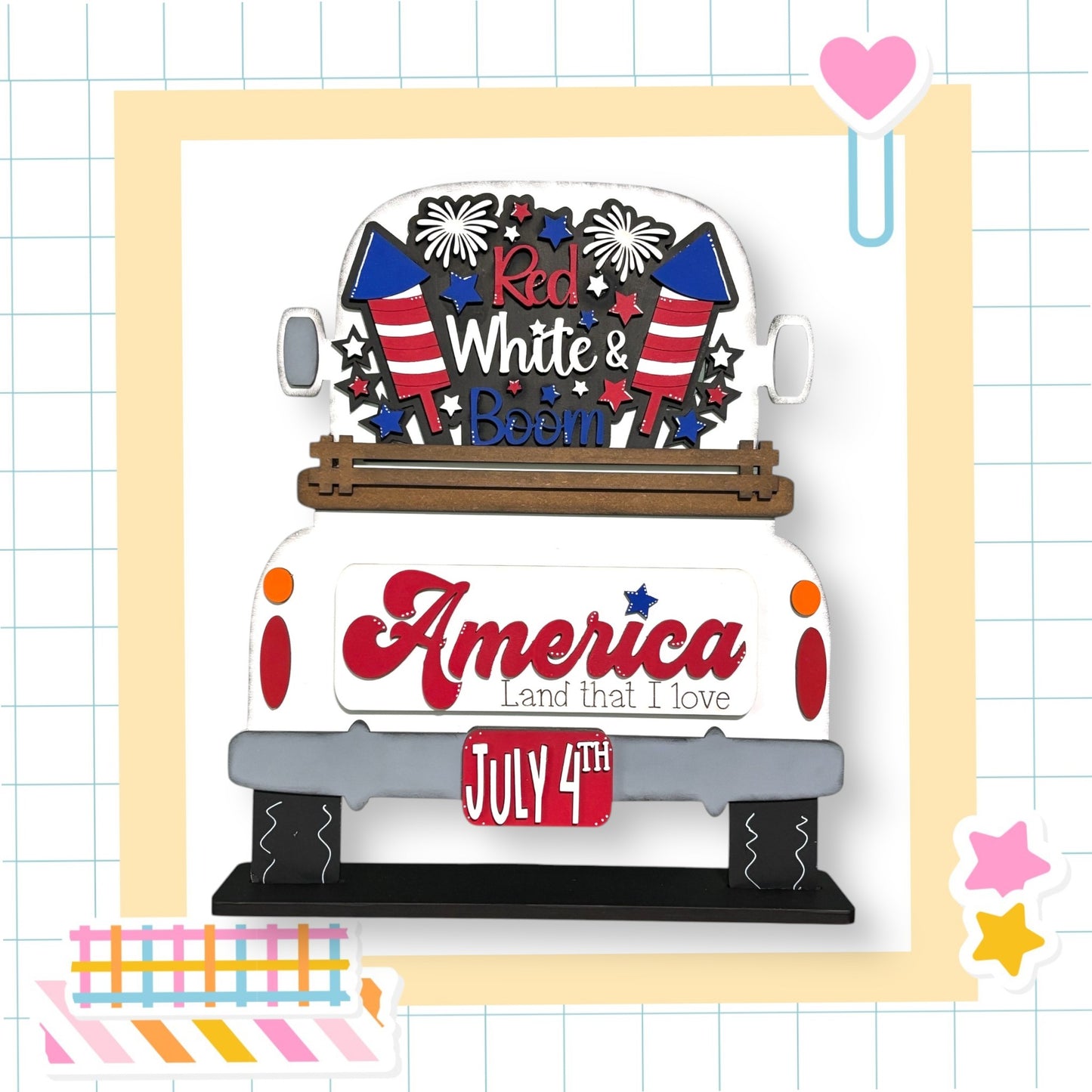 a white truck with red, white and blue decals on it