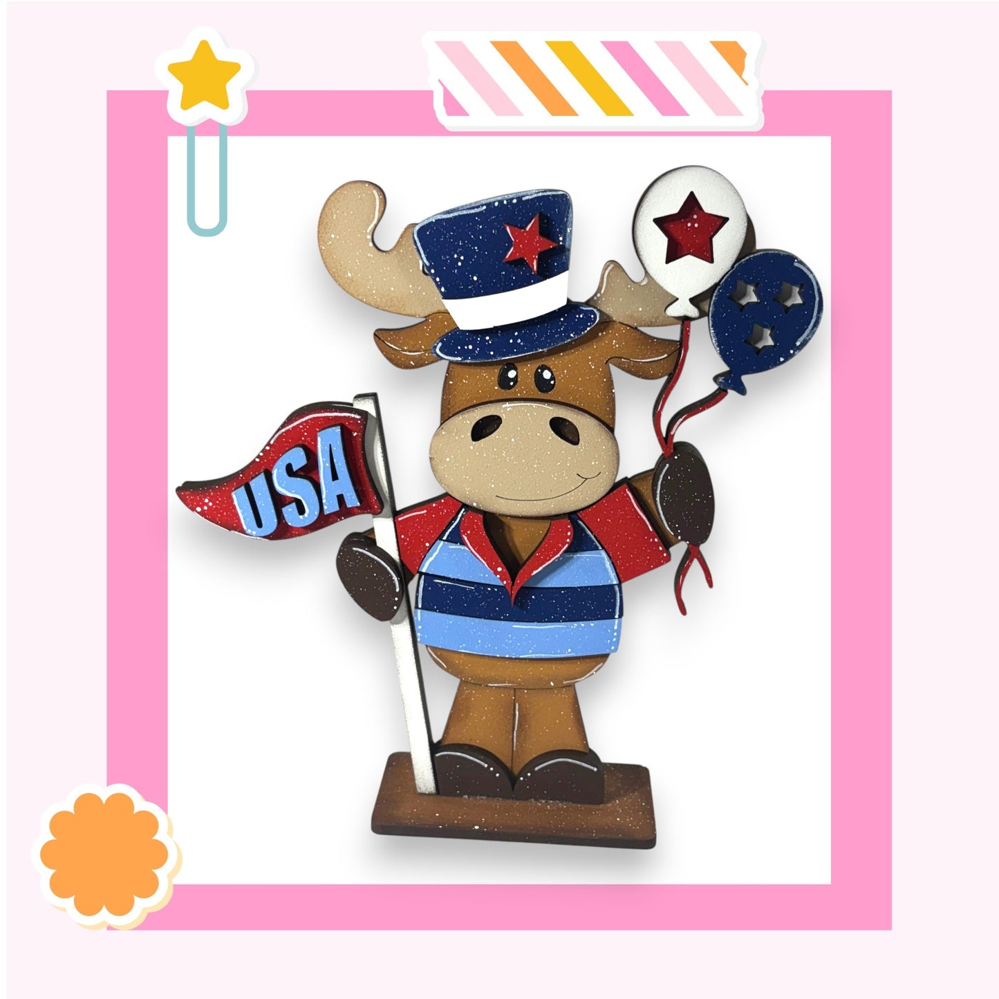 A cartoon moose wearing a patriotic hat and holding a flag and balloons, representing the United States.