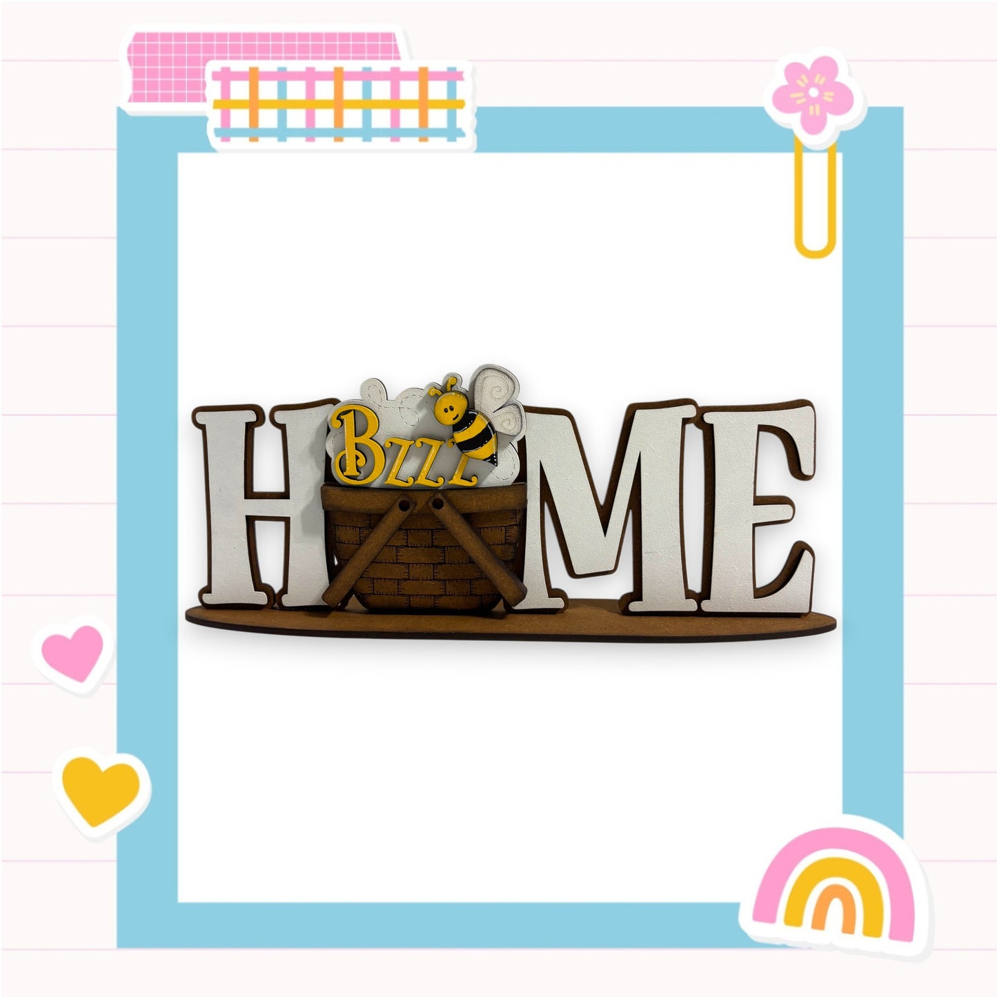 a wooden sign with the word "HOME" written on it, surrounded by various colorful and decorative elements such as hearts, a flower, and a rainbow.
