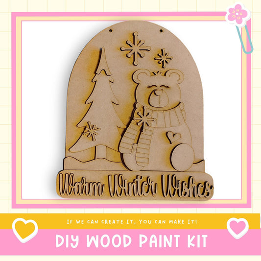 a DIY wood paint kit for creating a wooden snow globe with a bear and snowflakes.