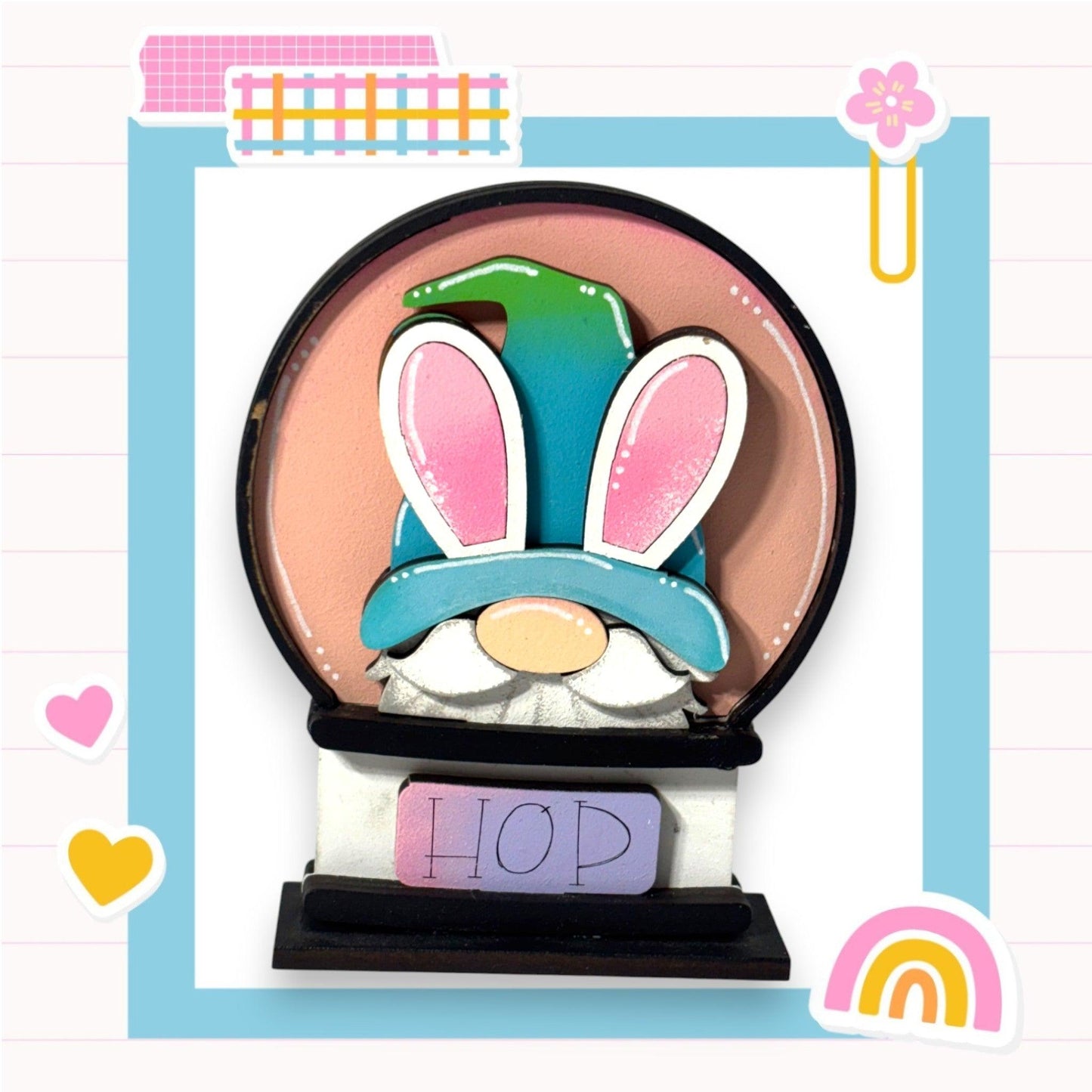 a paper sculpture of a rabbit with a hat