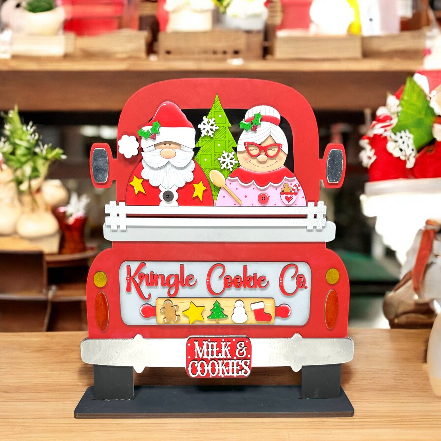 a red truck with a santa clause on the back of it