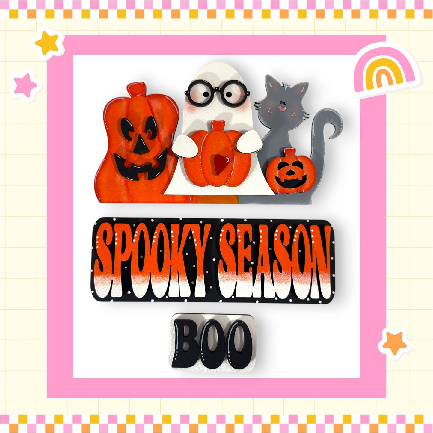 The image is a Halloween-themed collage featuring a spooky "Spooky Season" banner, a ghost, a cat, and a pumpkin. The banner has the text "Spooky Season" in a bold, orange font, and the word "BOO" is displayed below it. The background of the image is pink and white, with a checkered pattern.