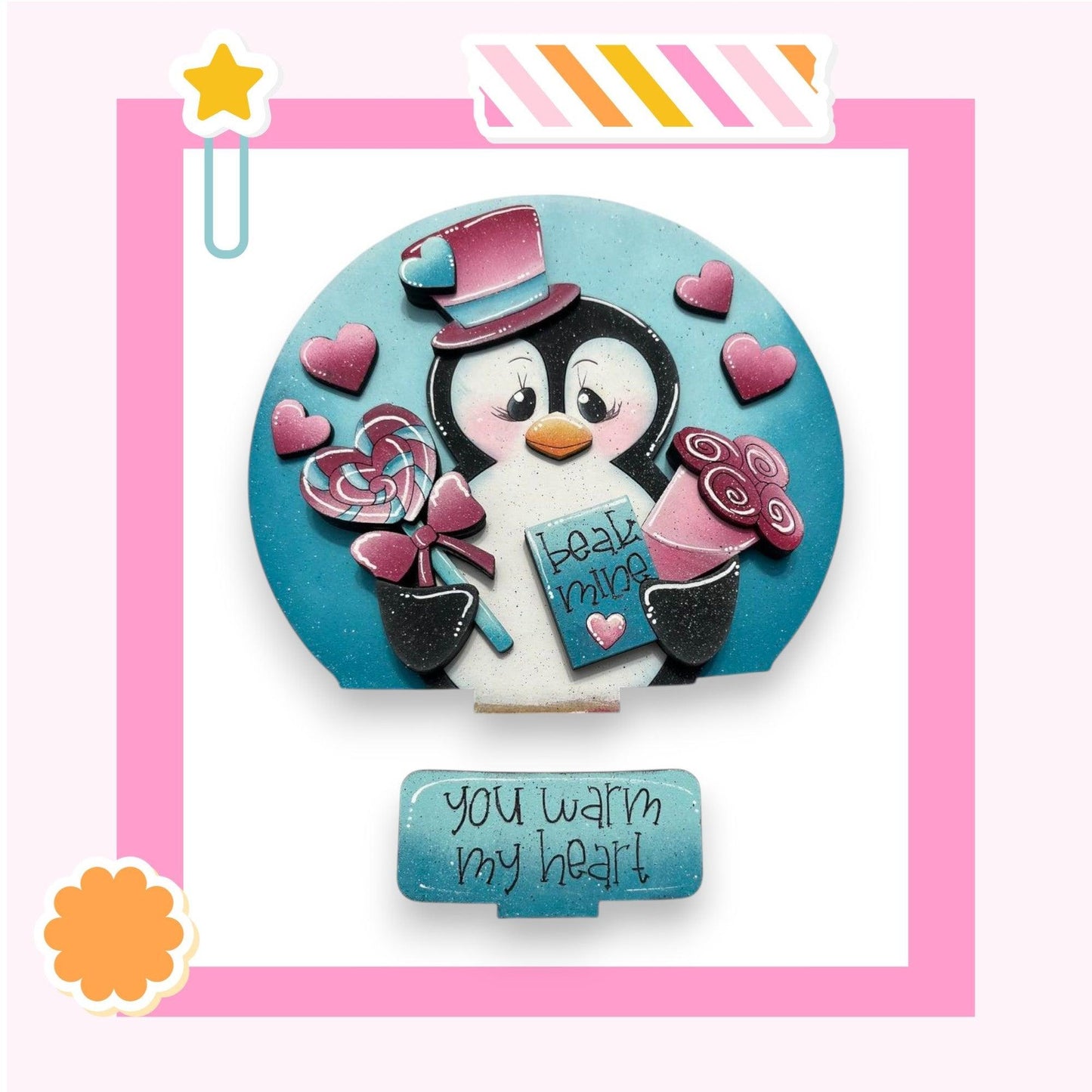 a picture of a penguin holding a candy bar