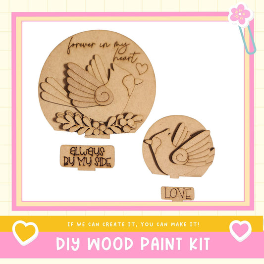 a DIY wood paint kit with a bird-shaped cutout and a heart-shaped cutout, along with a motivational message.
