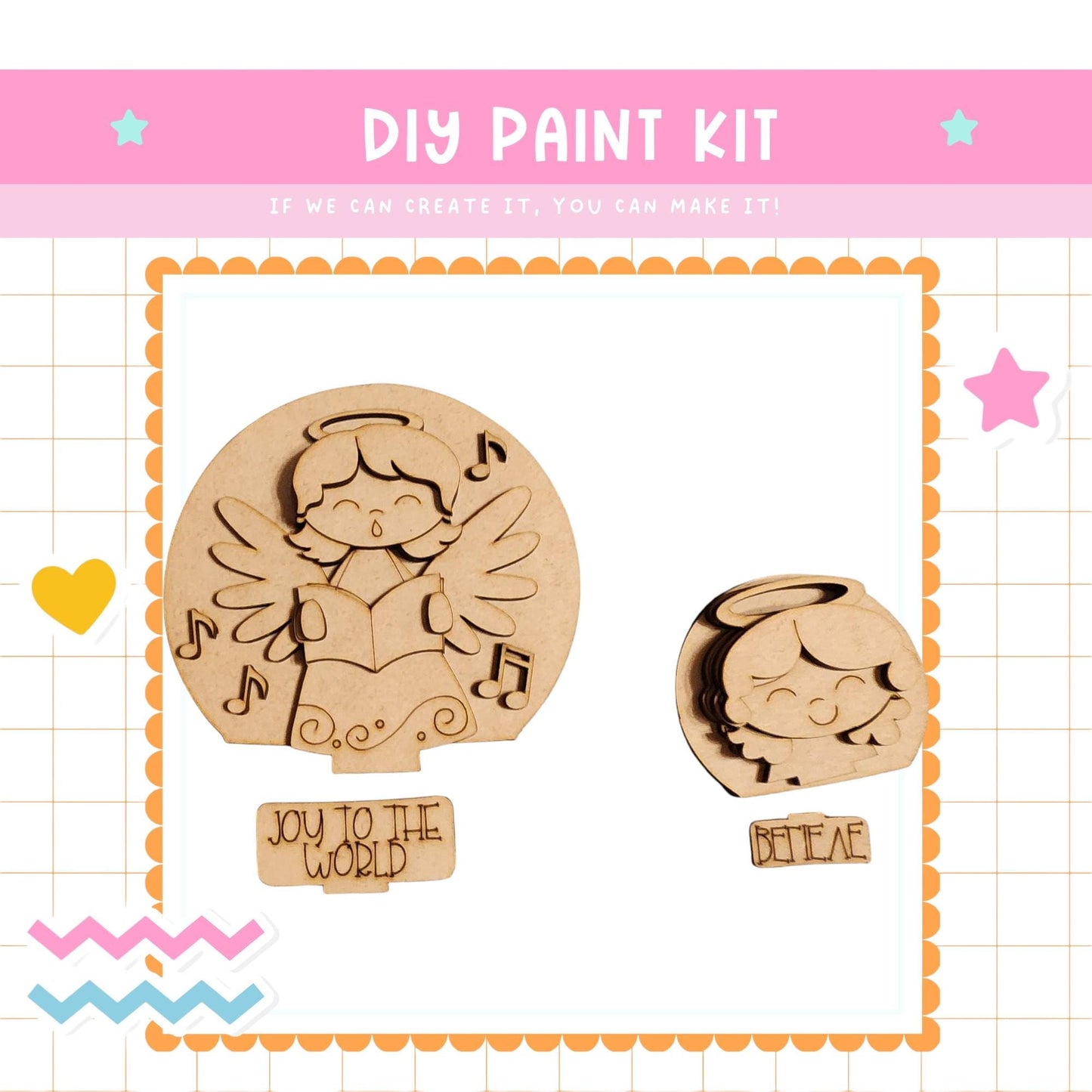 The image is a DIY paint kit featuring two wooden angel-shaped cutouts, one larger and one smaller, with musical notes and the phrase "Joy to the World" written on them.