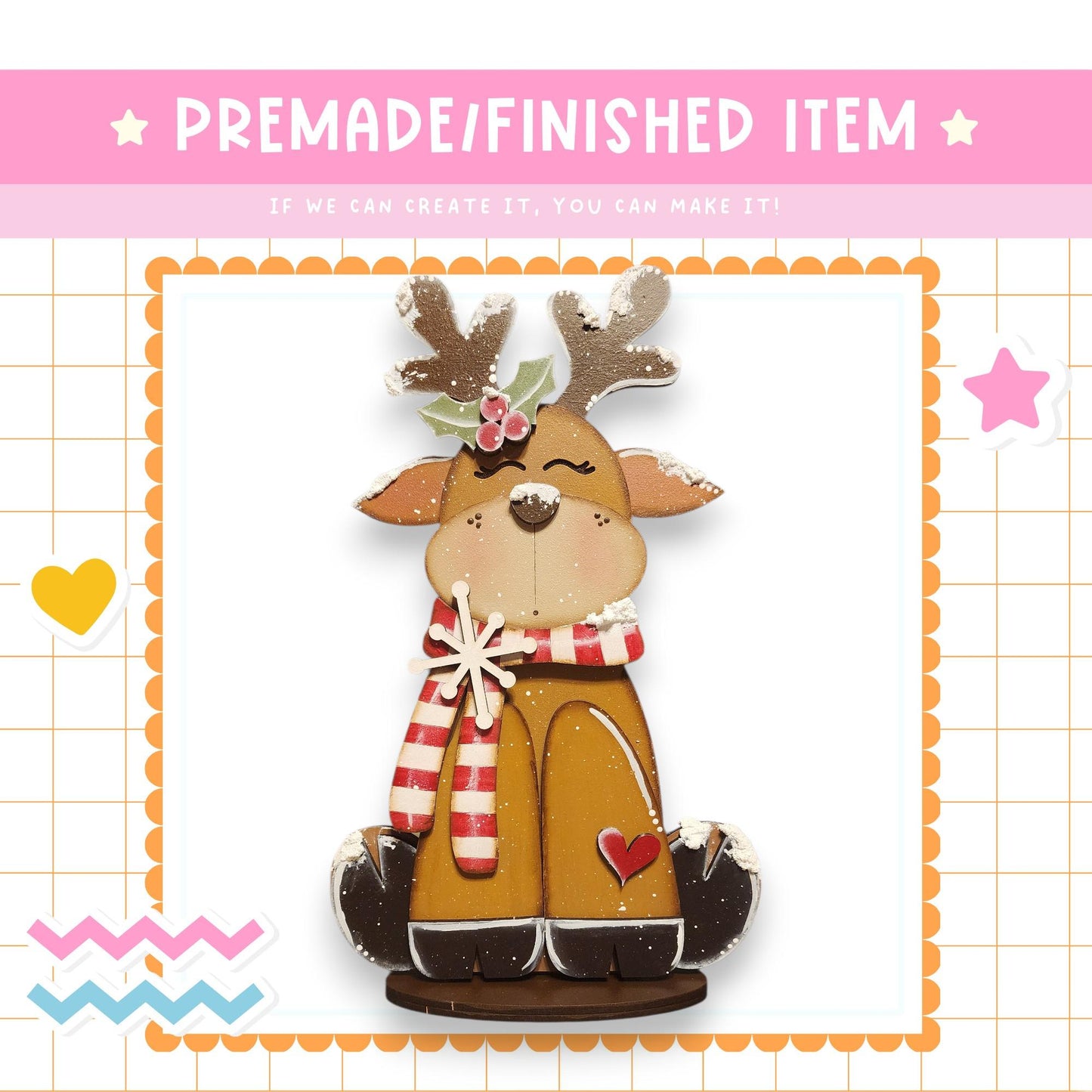 a wooden reindeer figurine with antlers and a scarf, set against a pink background with a grid pattern.