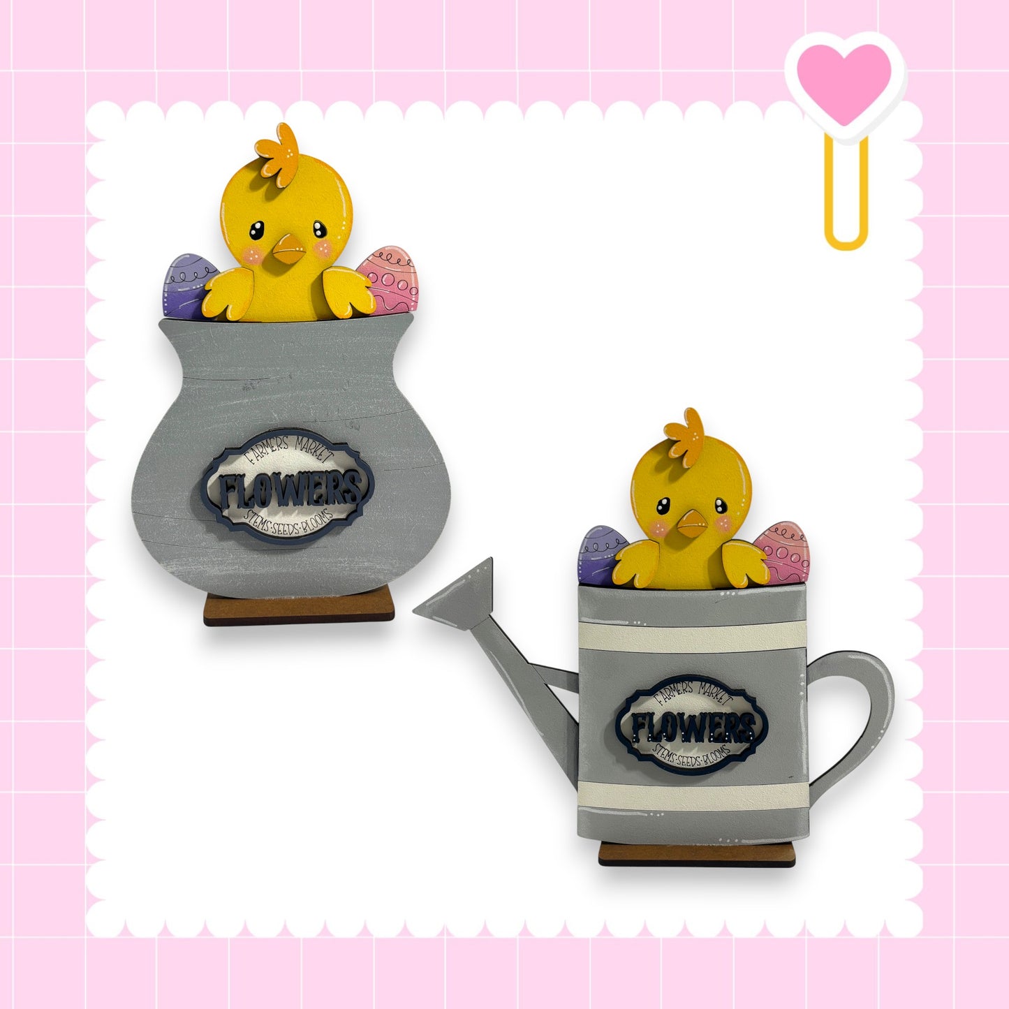 two wooden bird figurines, one in a vase and the other in a watering can, both with the word "FLOWERS" written on them.