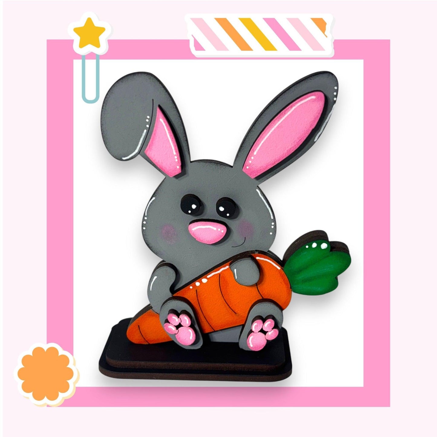 a picture of a bunny holding a carrot