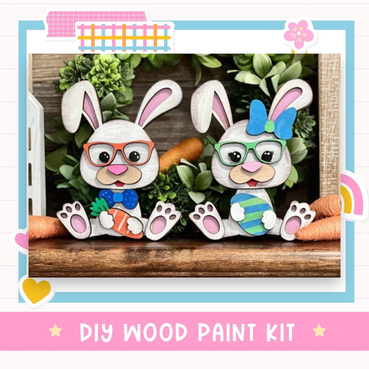 two white rabbits wearing glasses and holding carrots, sitting on a wooden surface. The rabbits are surrounded by a wreath of greenery and a rainbow-colored flower. The image also includes text that reads "DIY WOOD PAINT KIT" and "Easter Bunny".