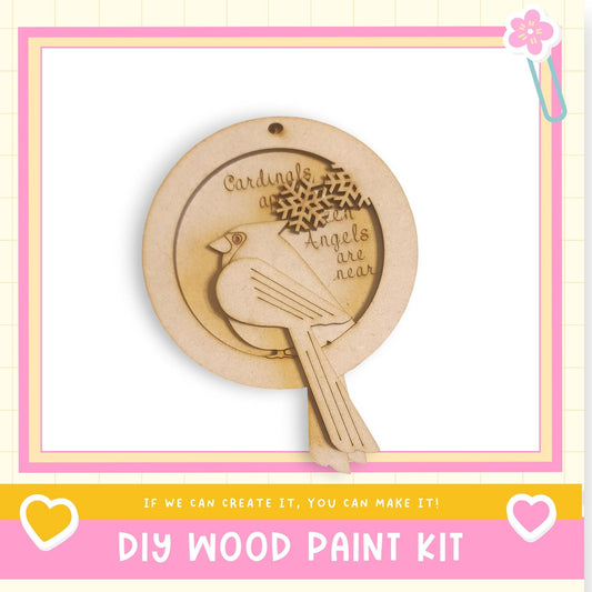 a DIY wood paint kit with a wooden bird ornament and a heart-shaped frame.