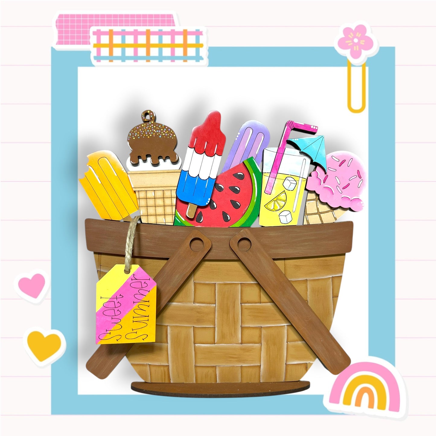 A basket filled with various colorful and whimsical objects, including a cake, ice cream, and other playful items, set against a light blue background with a pink and white checkered pattern.