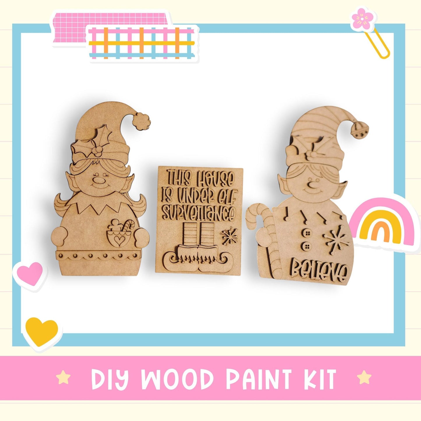 a DIY wood paint kit with two wooden elf figurines and a sign that reads "This house is under construction".