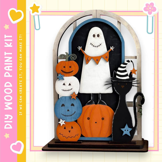 A Halloween-themed display featuring a ghost, a cat, and various pumpkins and jack-o-lanterns.