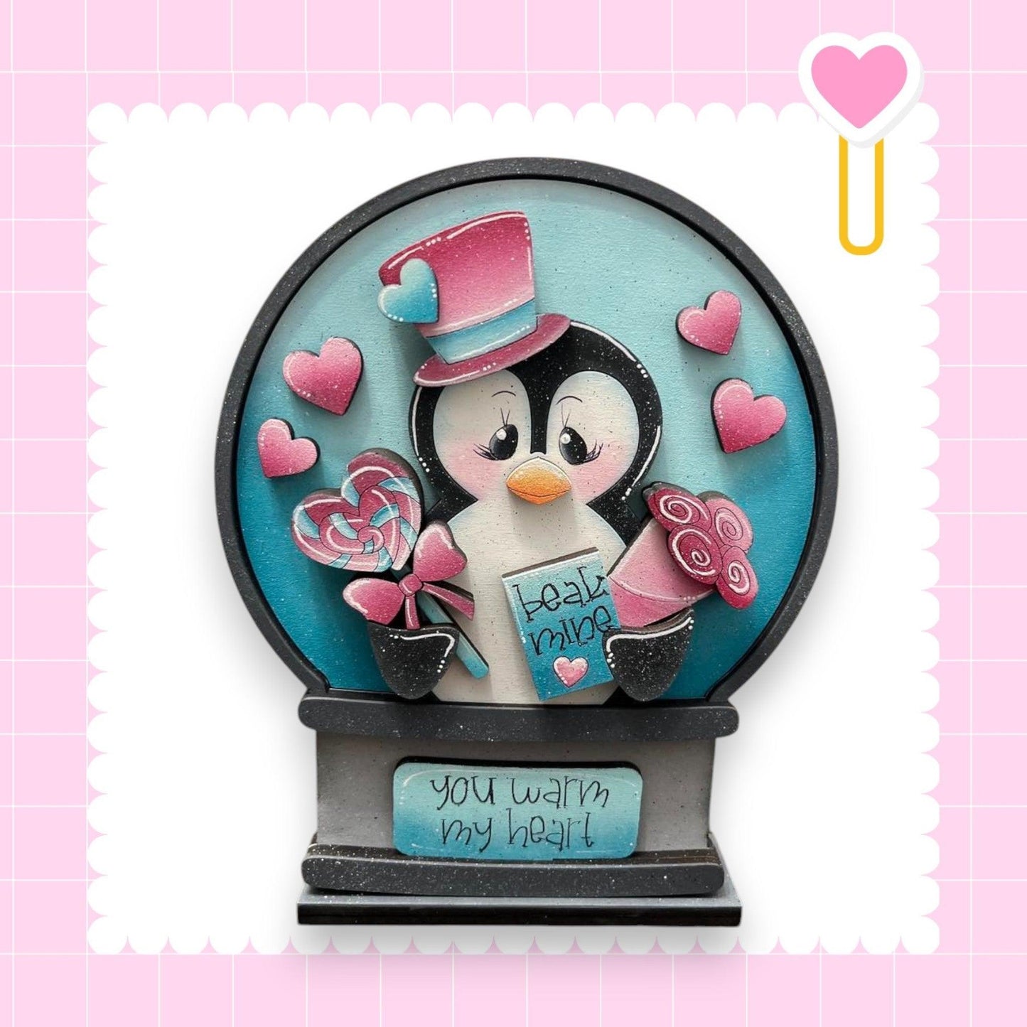 a snow globe with a penguin inside of it
