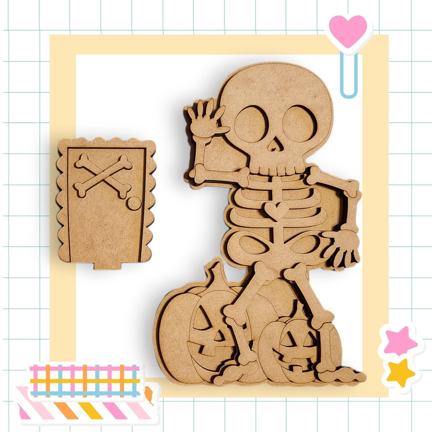A wooden skeleton figure is depicted in a playful pose, with a pumpkin and a door-shaped cutout nearby. The image is framed by a grid pattern, and there are additional cutouts and stickers scattered around the frame.