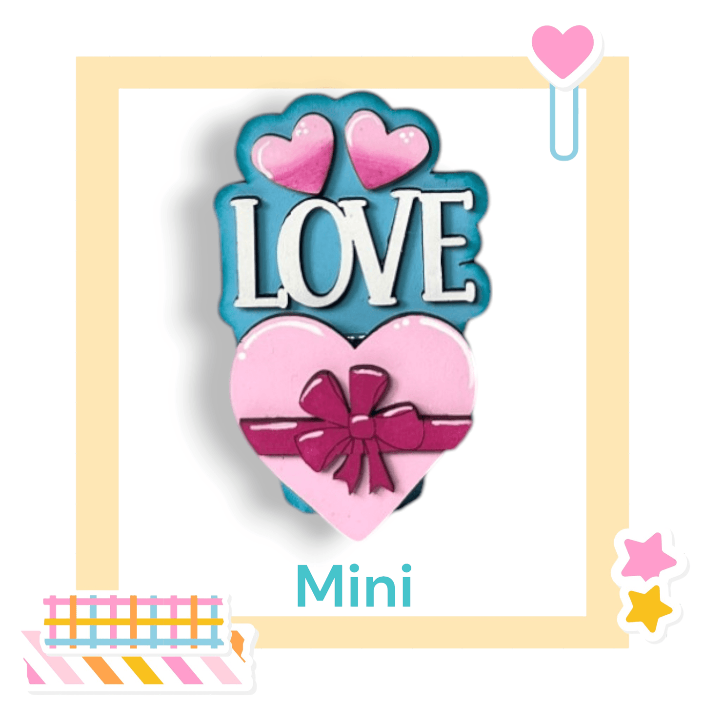 a cookie shaped like a heart with a bow