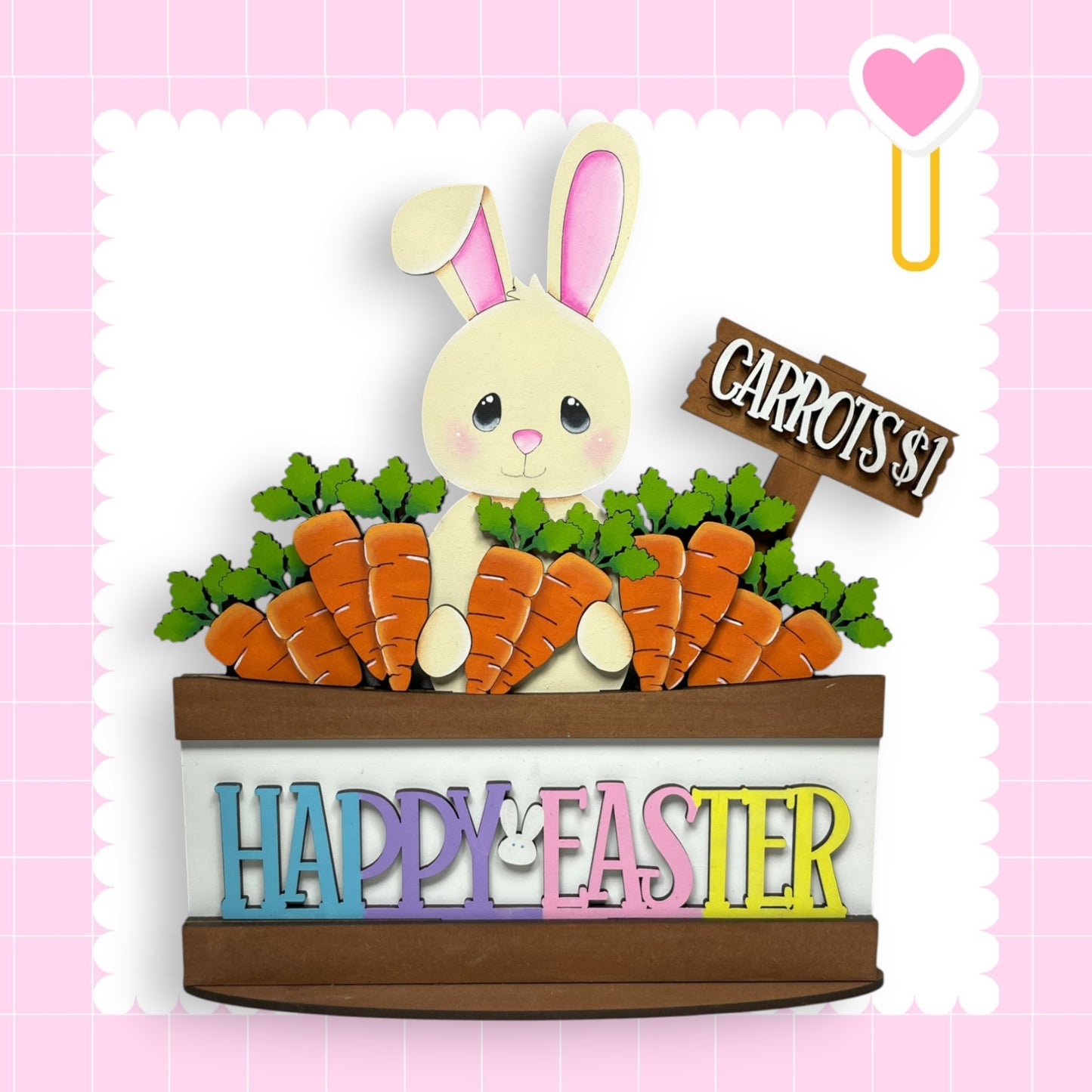 a card with a rabbit sitting in a basket of carrots