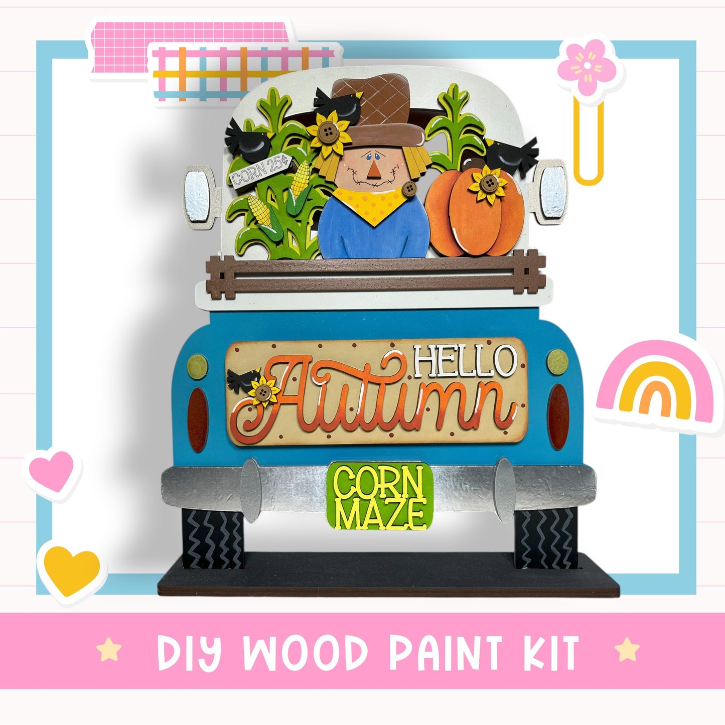A colorful and whimsical DIY wood paint kit featuring a scarecrow, corn maze, and fall-themed decorations.