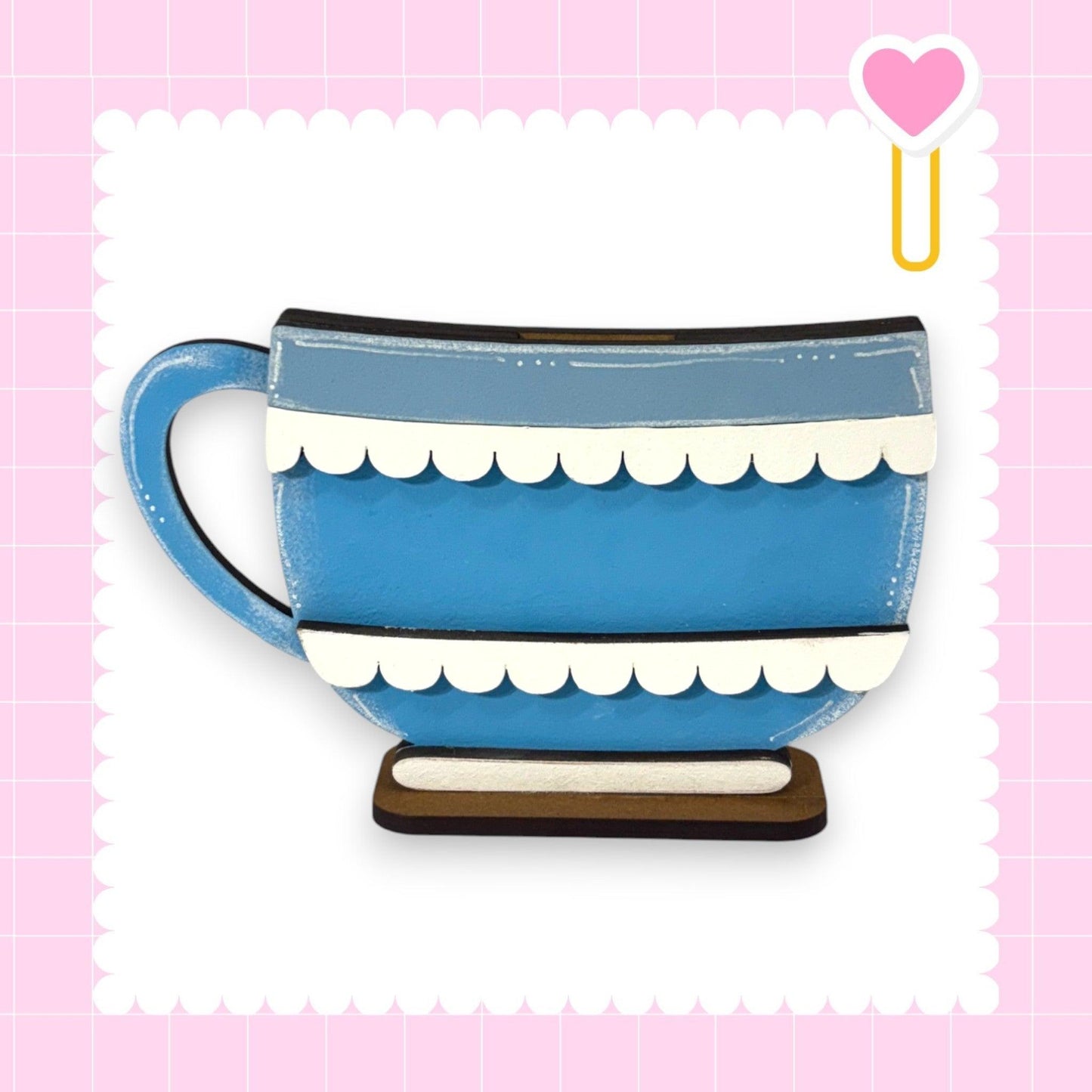 a blue and white coffee cup on a wooden stand