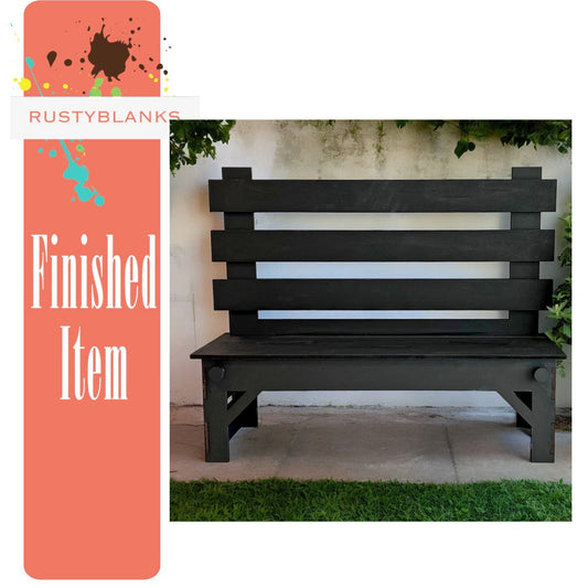 a wooden bench sitting in front of a building