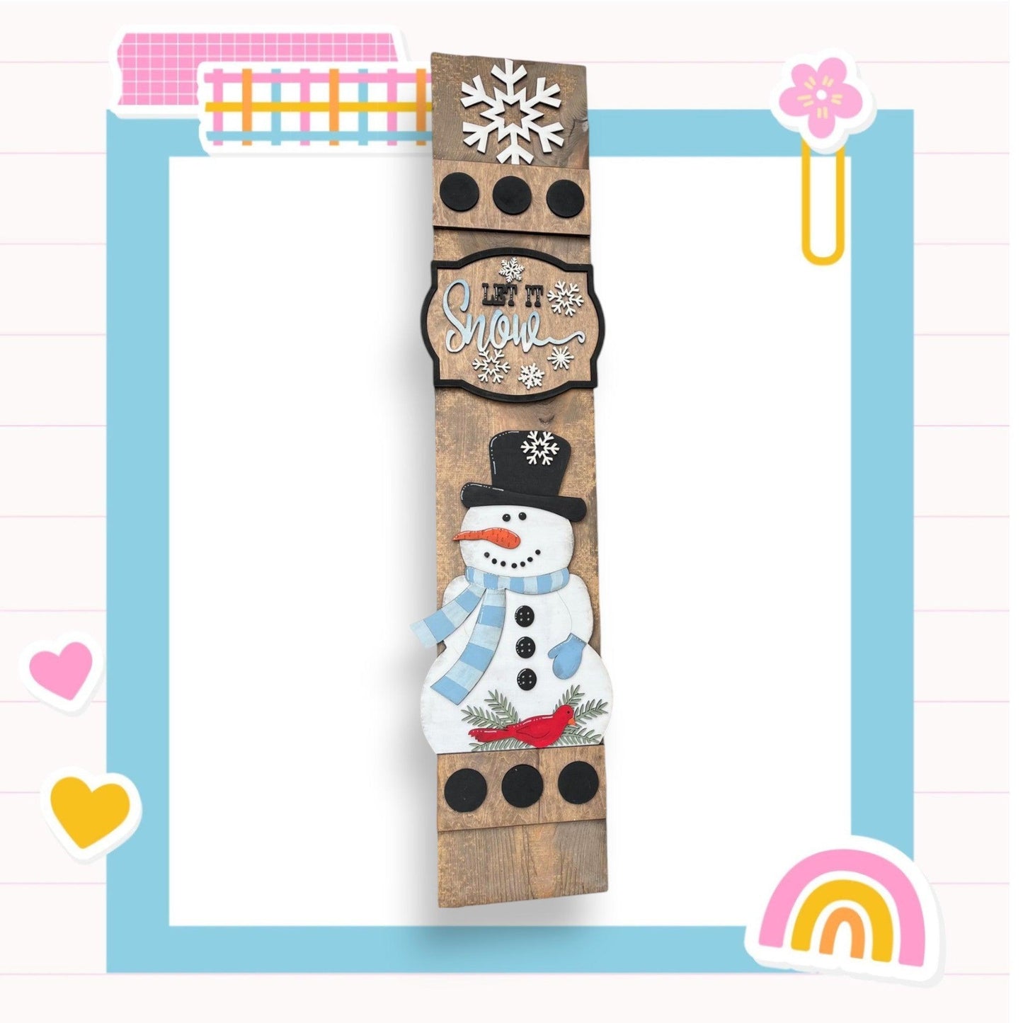 a picture of a snowman made out of wood