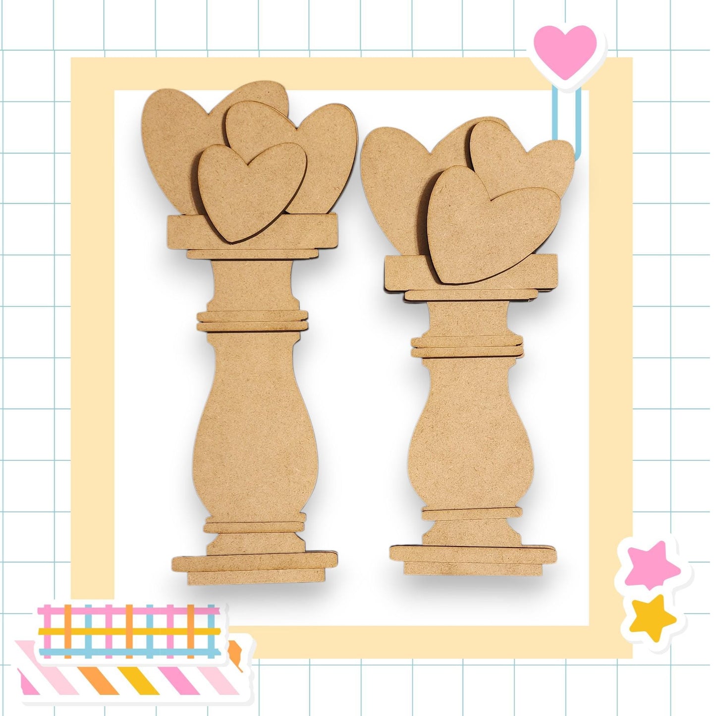 two wooden heart-shaped objects, possibly made of cardboard or a similar material, arranged in a square frame.