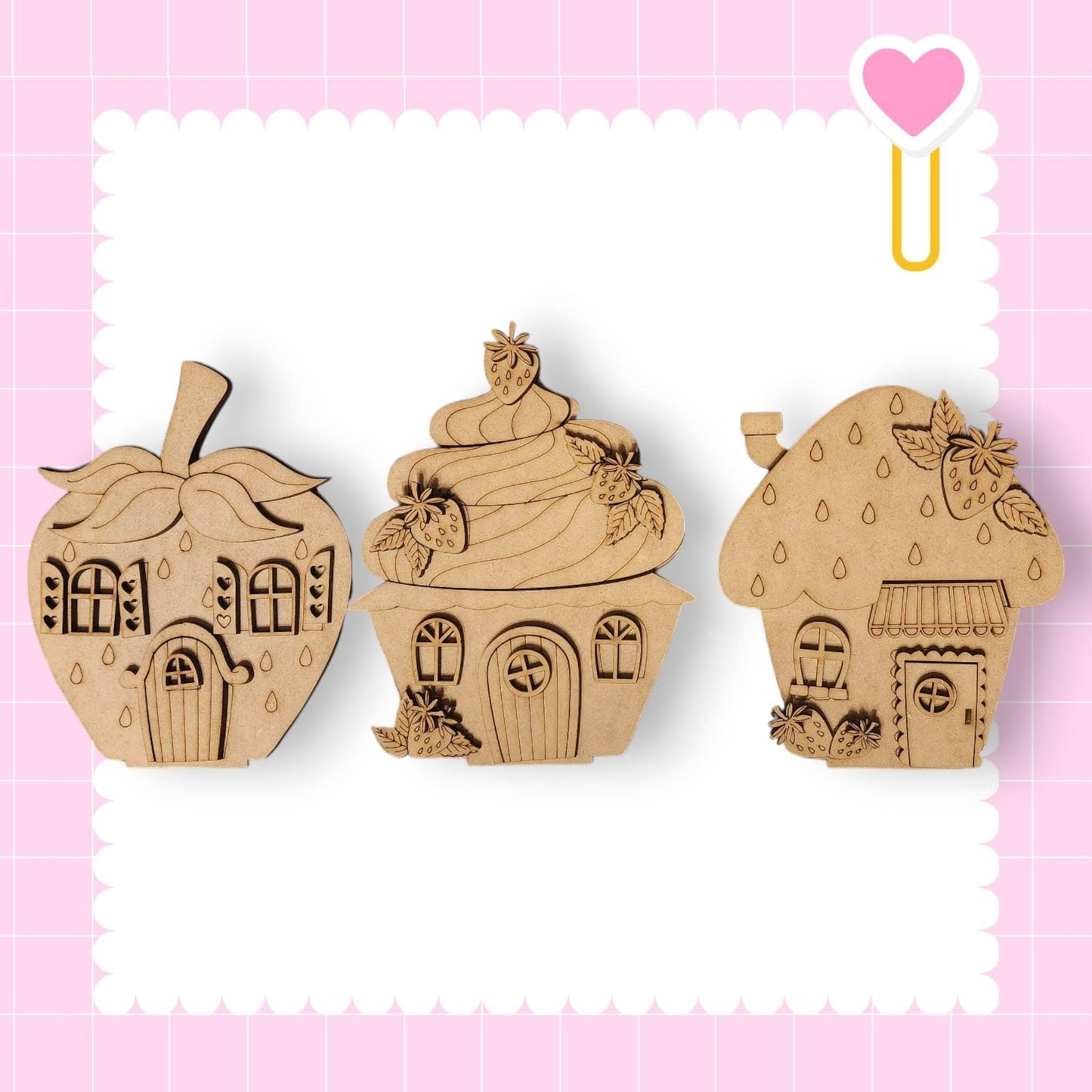 three wooden cut outs of cupcakes and a house