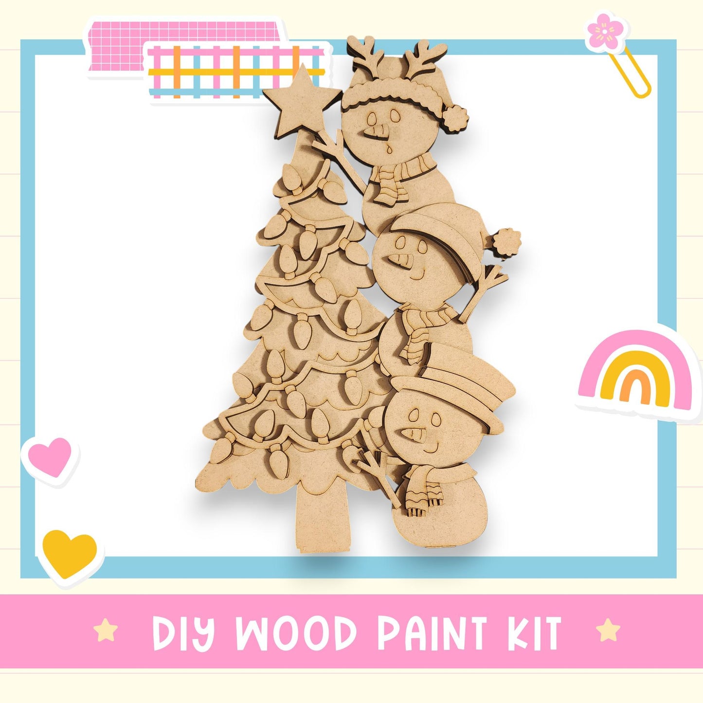 A DIY wood paint kit featuring a wooden Christmas tree with three snowmen and a star on top, surrounded by various colorful stickers and a rainbow.