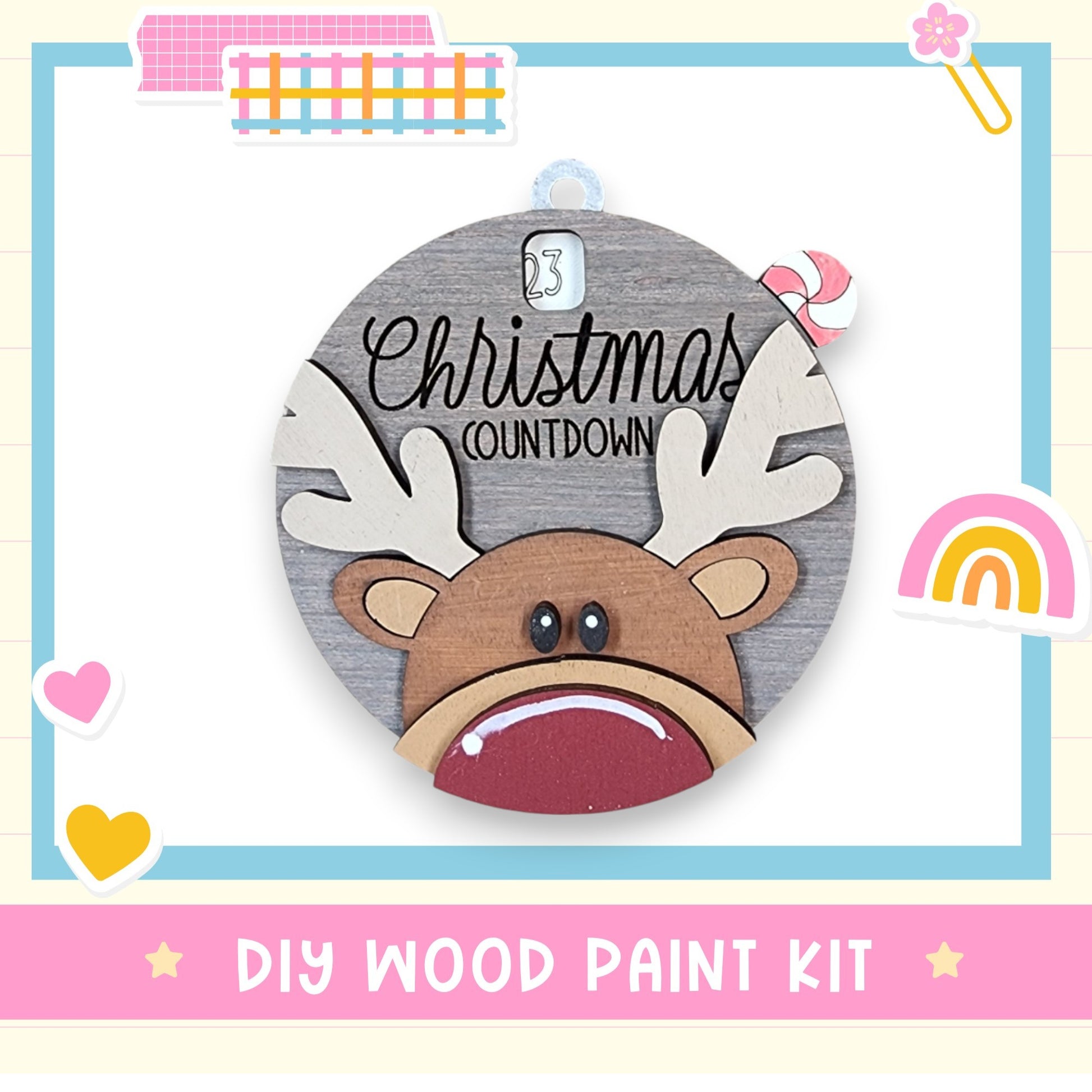 a wooden christmas ornament with a reindeer's face