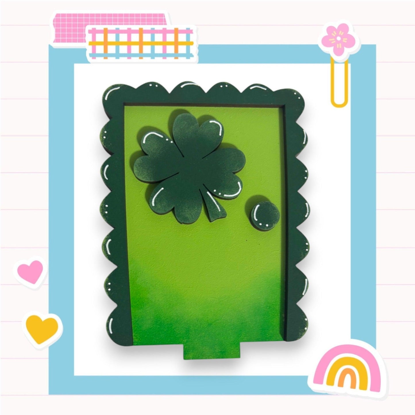 a green card with a four leaf clover