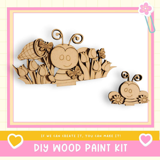 The image is a DIY wood paint kit featuring a wooden bee and flower decoration.