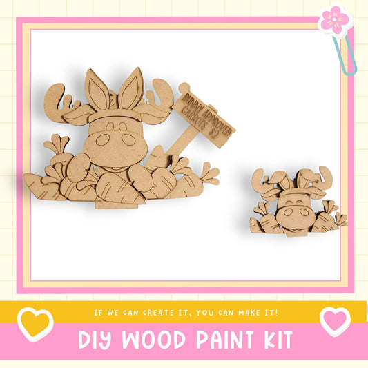 a DIY wood paint kit with a cartoon moose and a smaller moose figure. The kit appears to be made of wood and is designed for creating wooden figures.