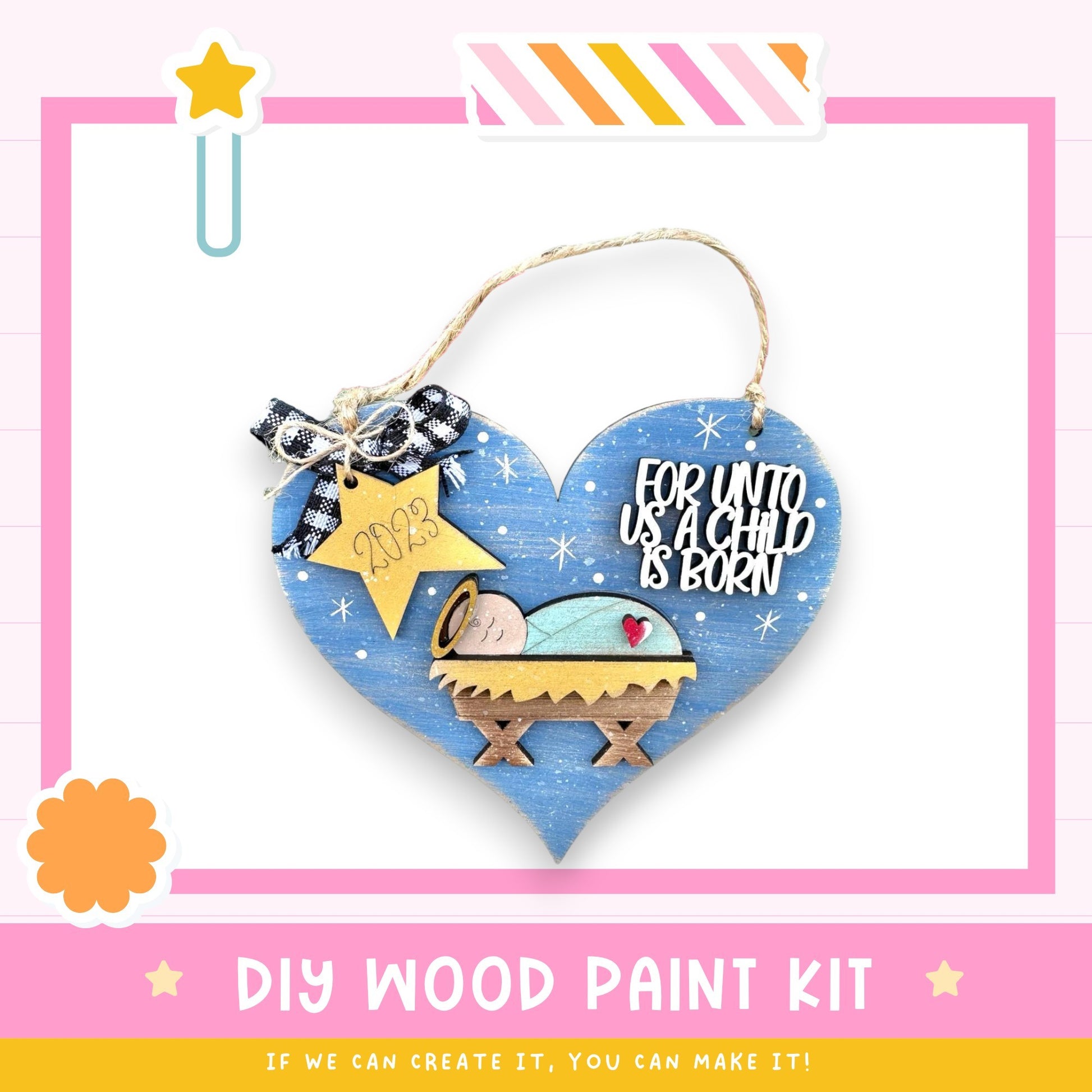 a heart shaped ornament with a nativity scene on it