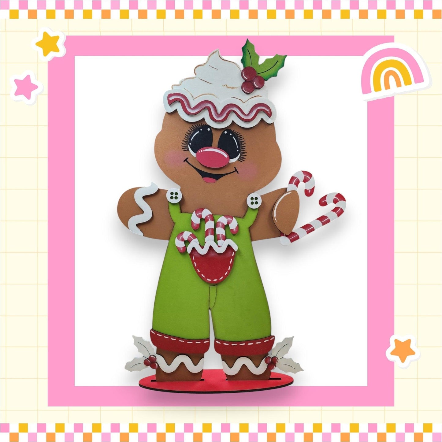a paper cutout of a ginger holding candy canes