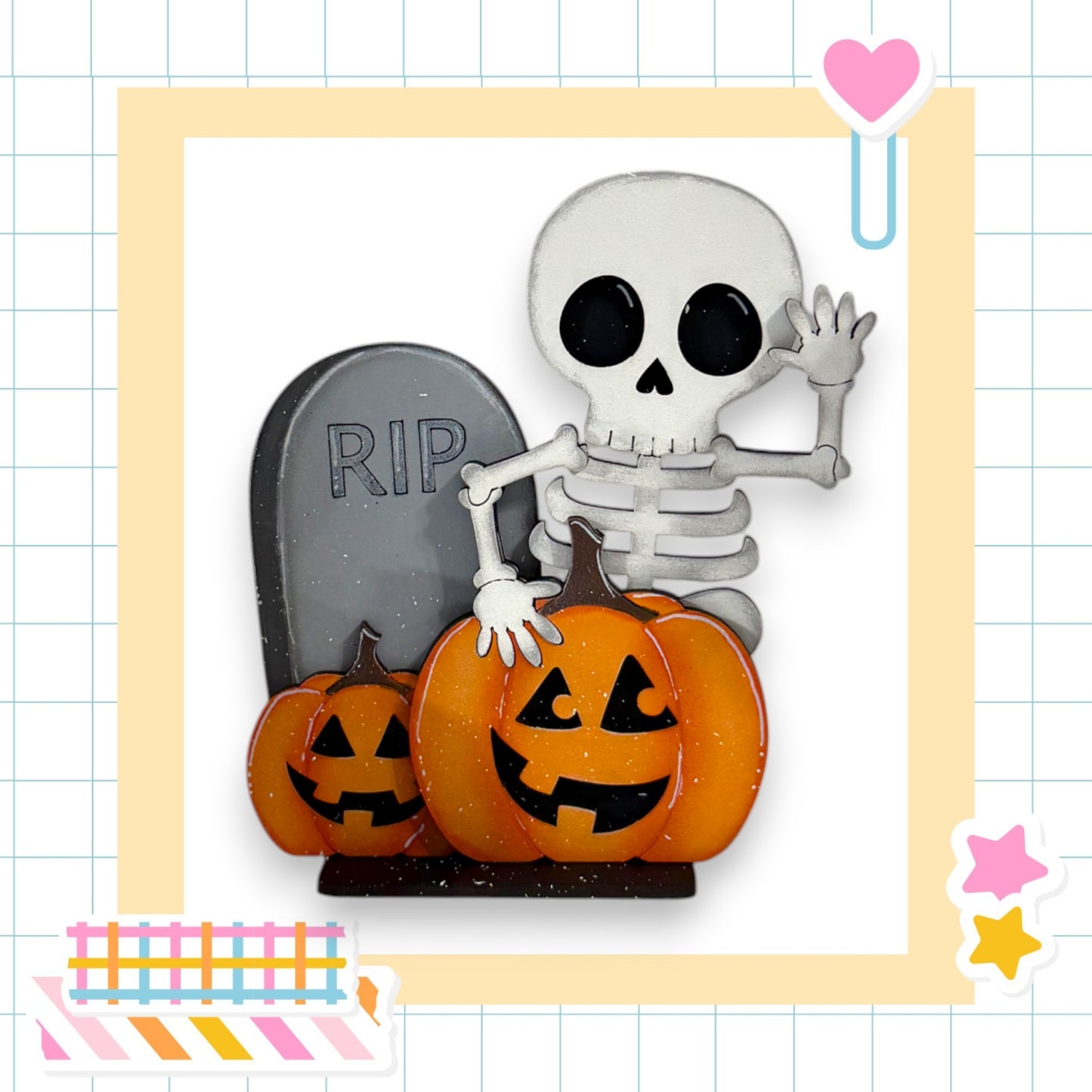 A skeleton wearing a skeleton costume is standing next to a gravestone with a carved pumpkin on top, surrounded by a colorful frame and Halloween-themed decorations.
