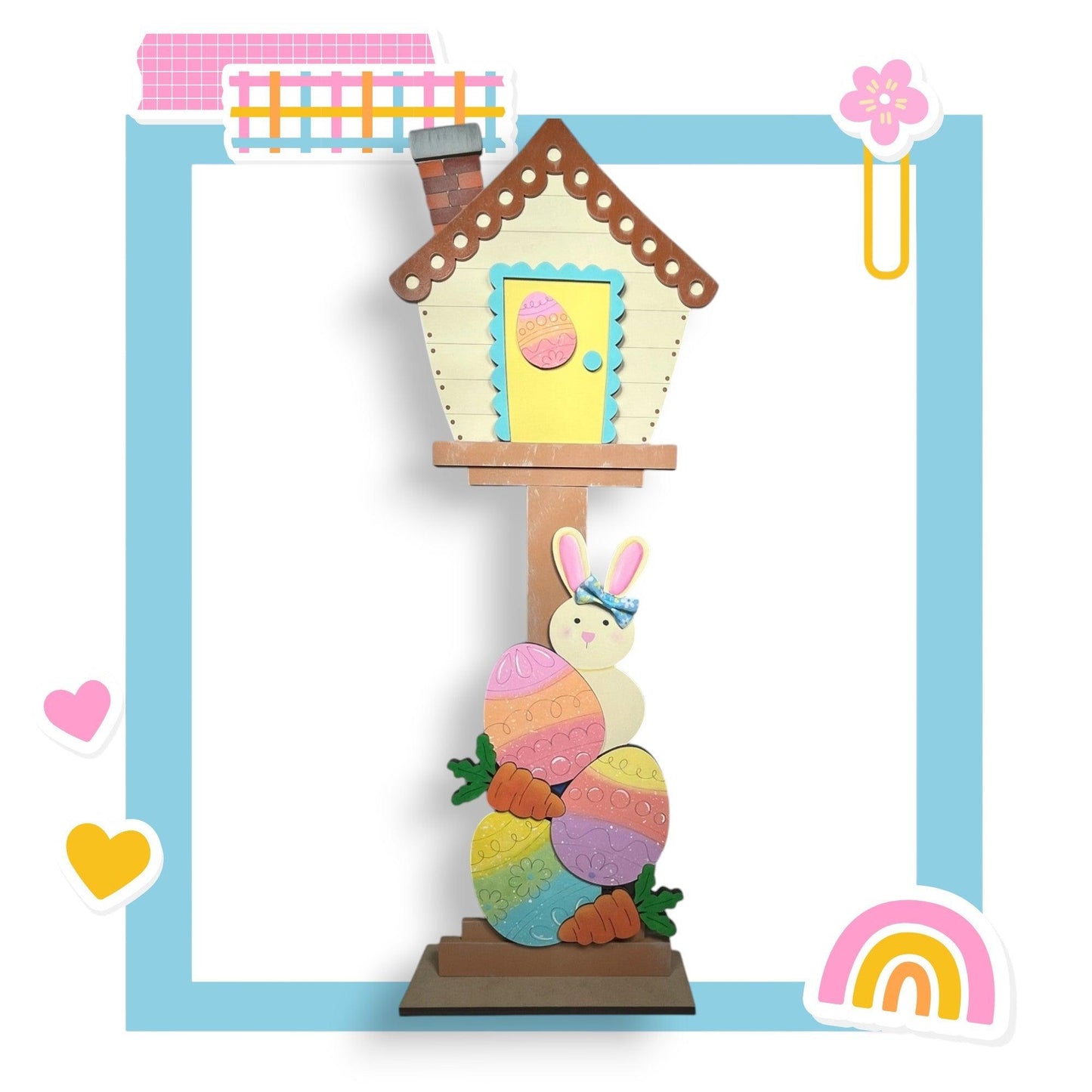 a paper sculpture of a bunny and a house