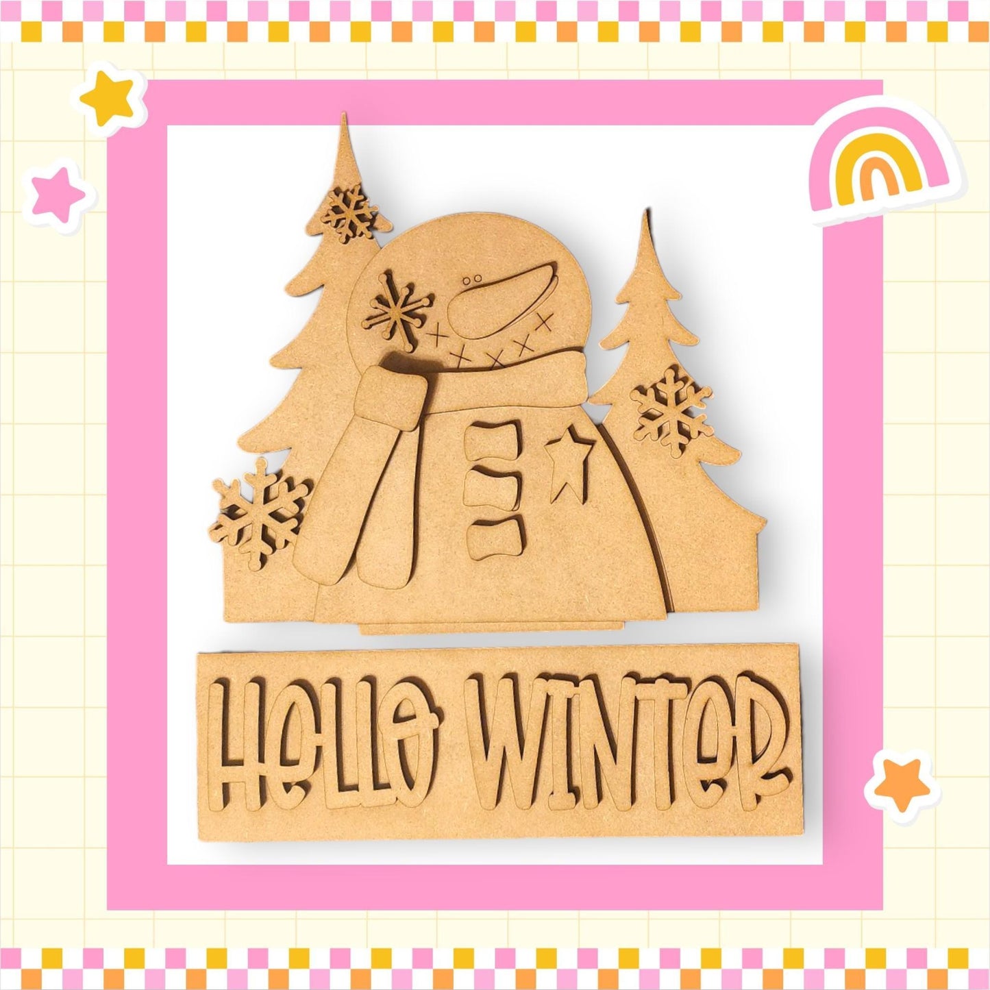 a wooden cutout of a snowman with a rainbow in the background