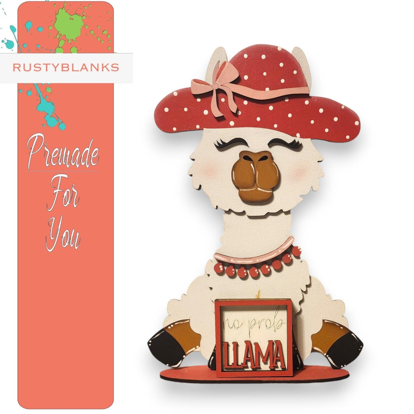 a paper cutout of a llama wearing a red hat