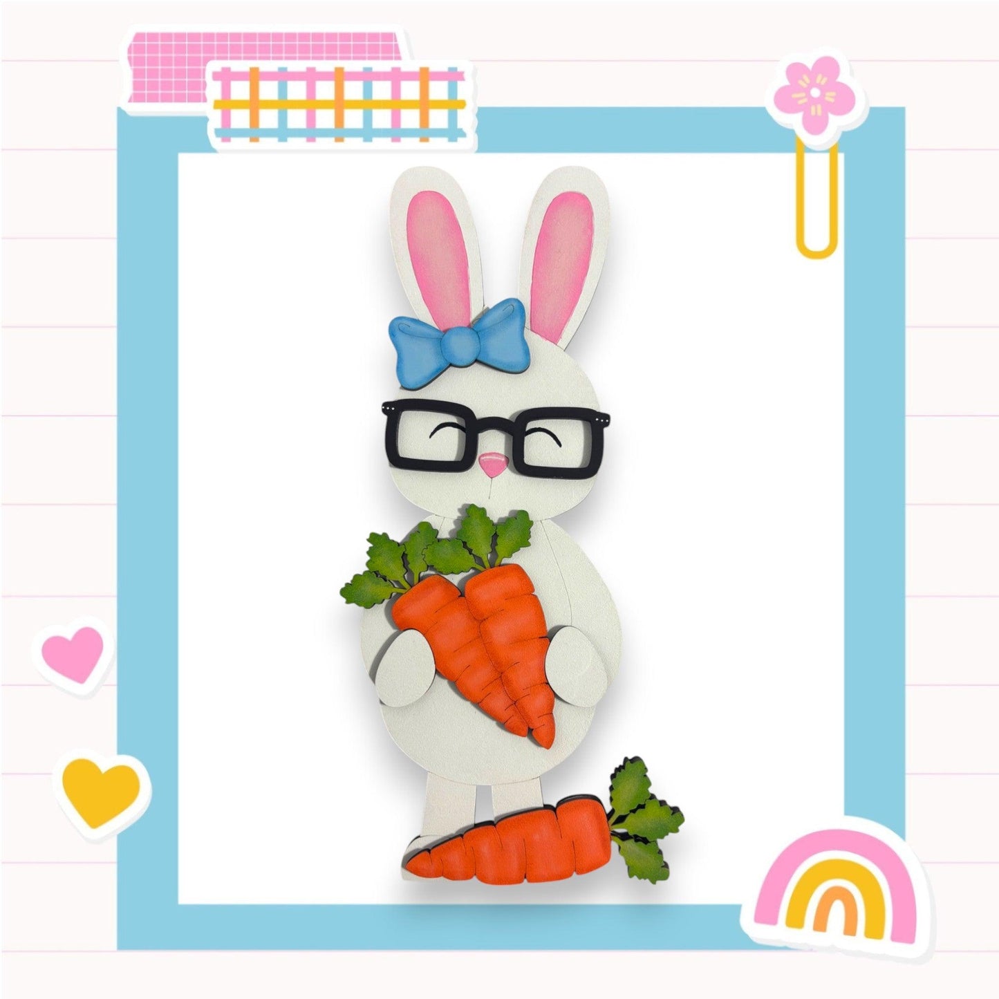 a paper cut of a bunny holding a carrot