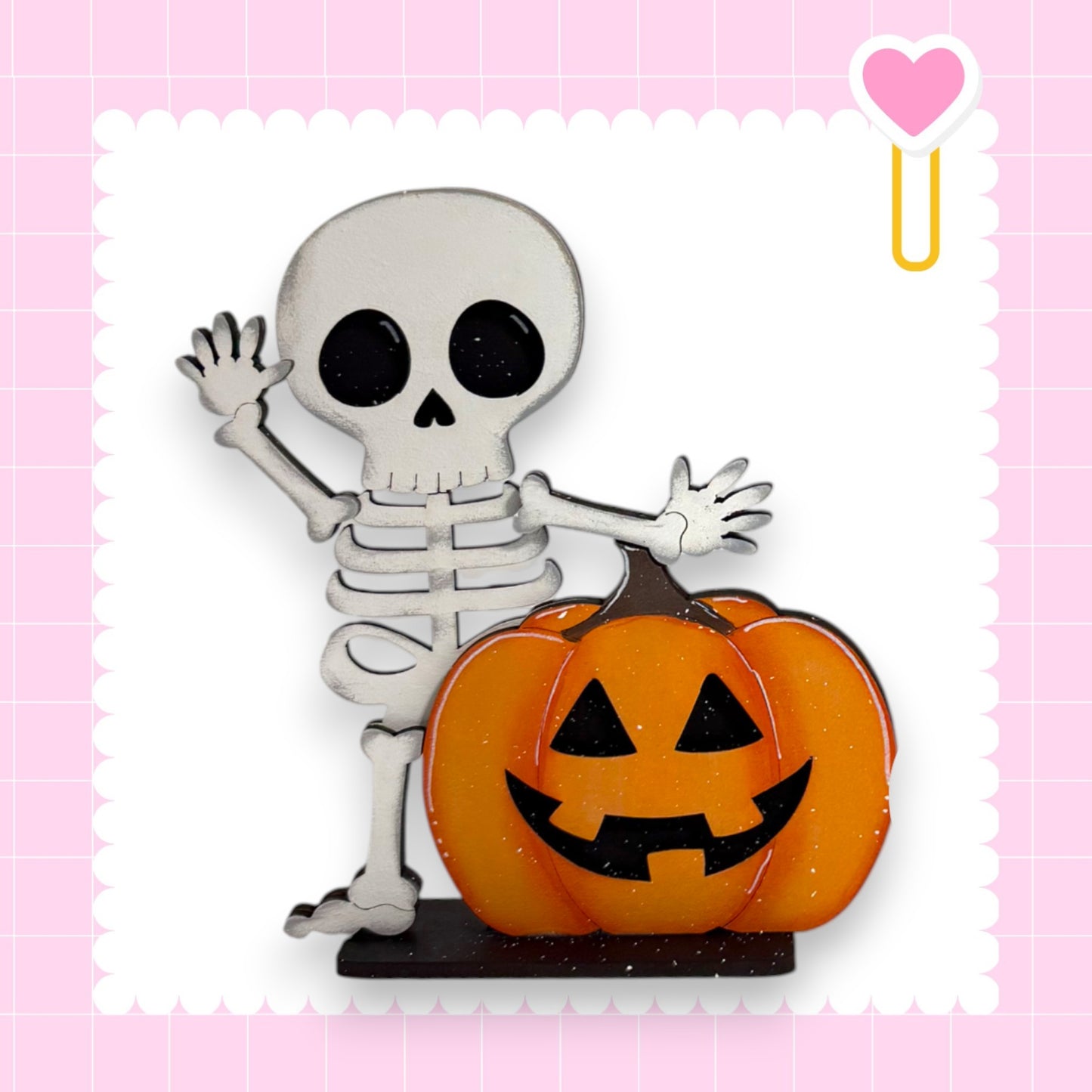 A skeleton figure is standing next to a carved pumpkin, both of which are part of a Halloween-themed decoration.