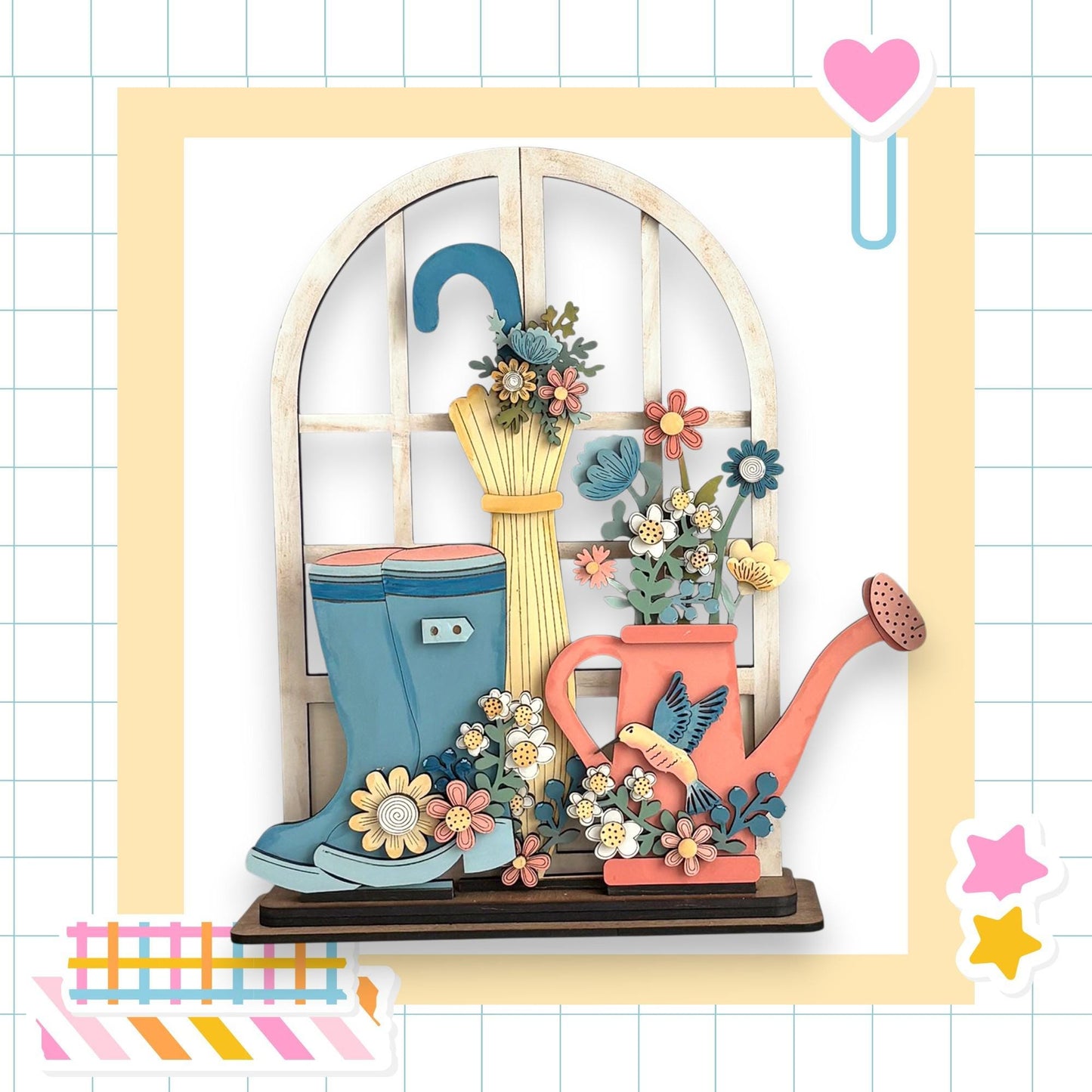 A wooden window sill with a vase of flowers, a pair of blue rain boots, and a pink watering can, all set against a white background with a grid pattern.