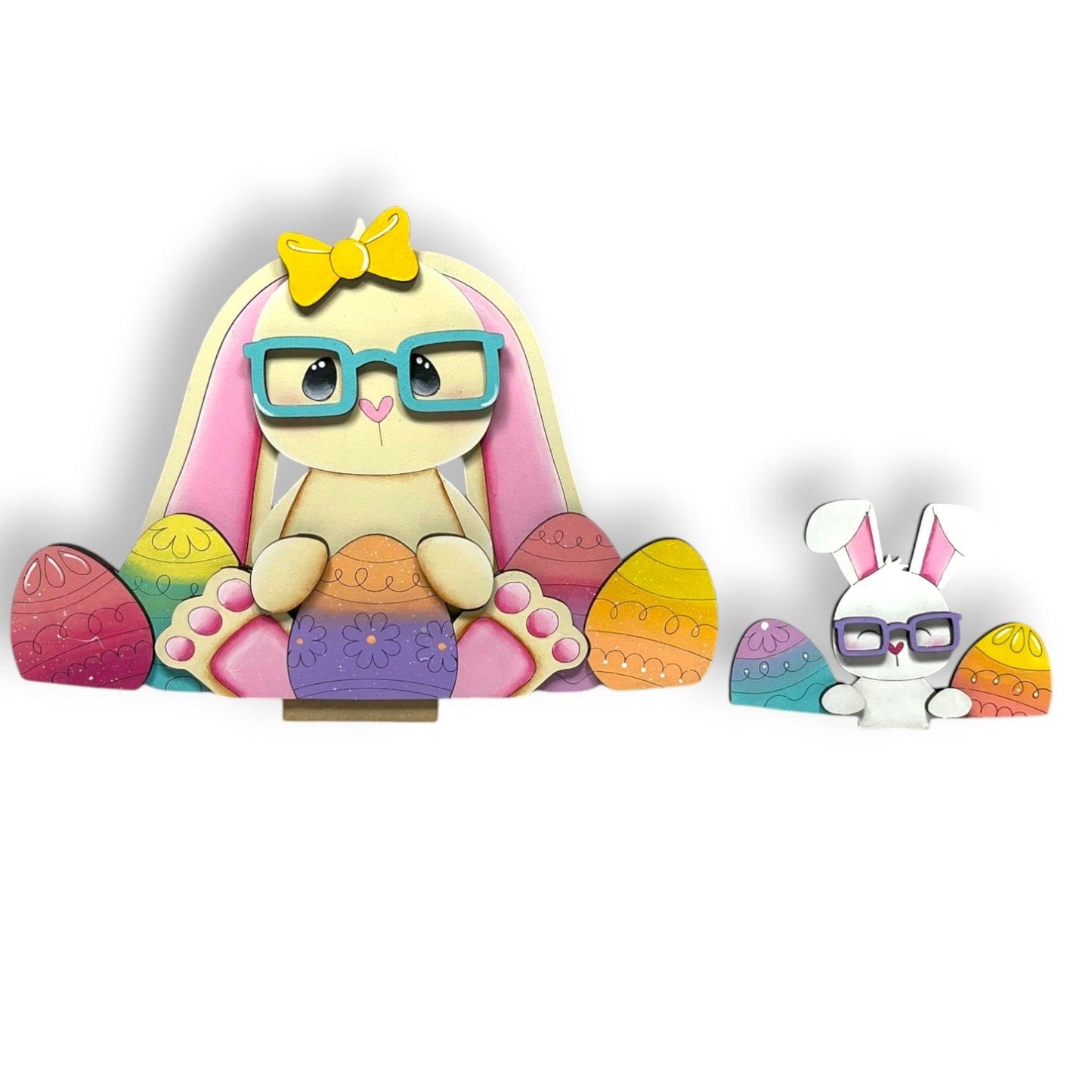 a wooden toy of a bunny with glasses sitting next to an easter egg