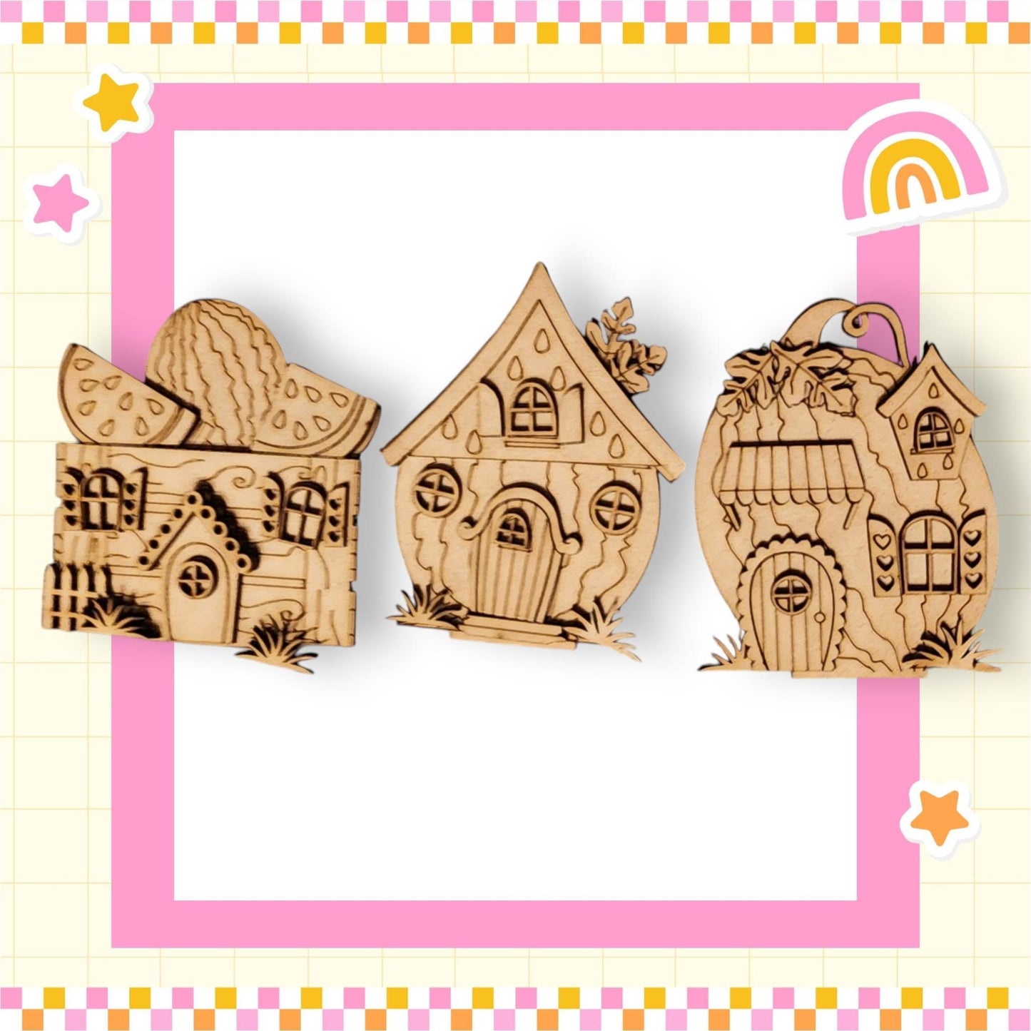 a wooden cutout of a house and a house with a rainbow in the background