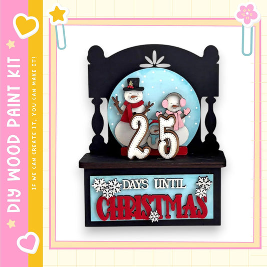 A snowman and a snowman figure on a shelf, with the number 25 displayed above them. The shelf has a sign that reads "25 DAYS UNTIL CHRISTMAS".