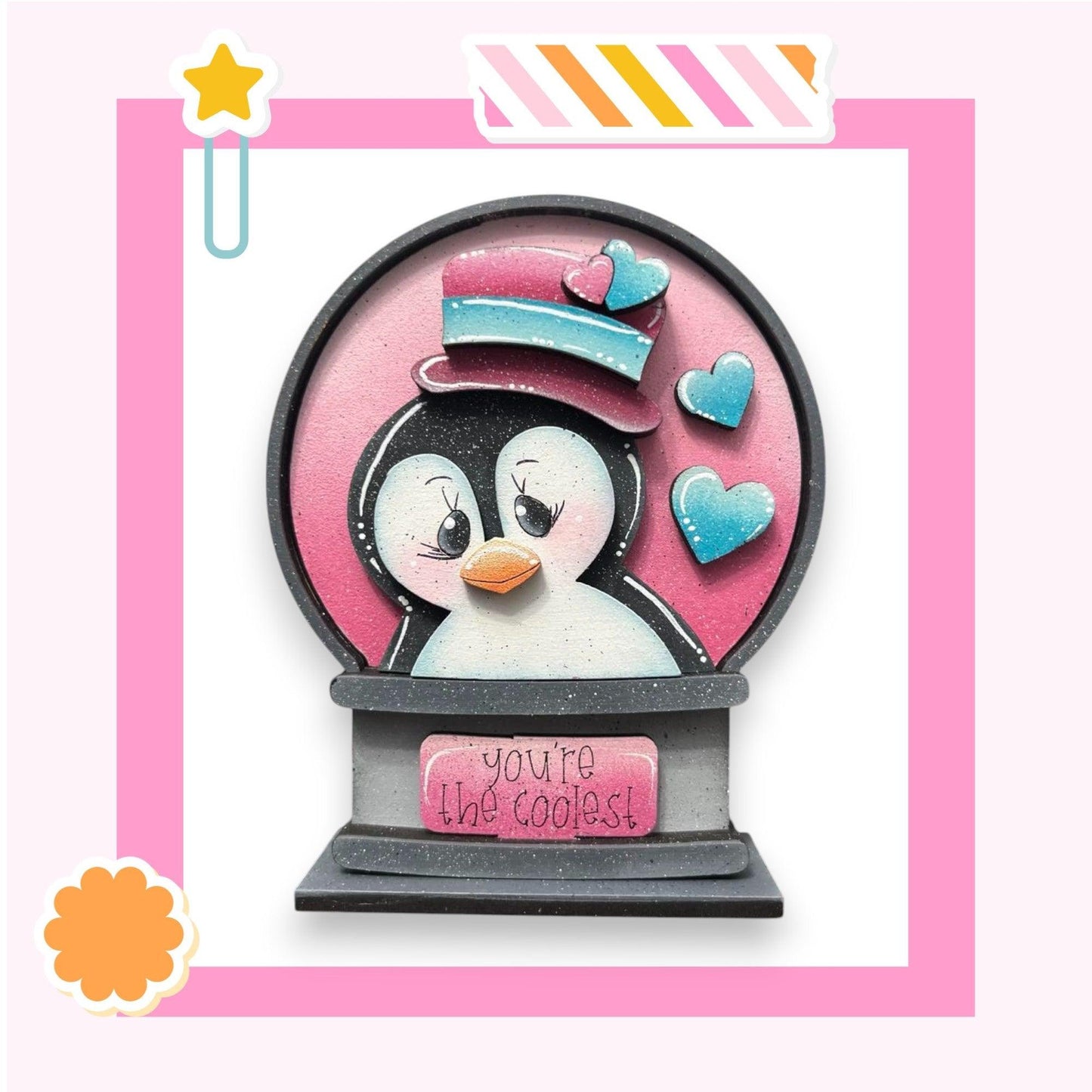 a picture of a penguin in a snow globe