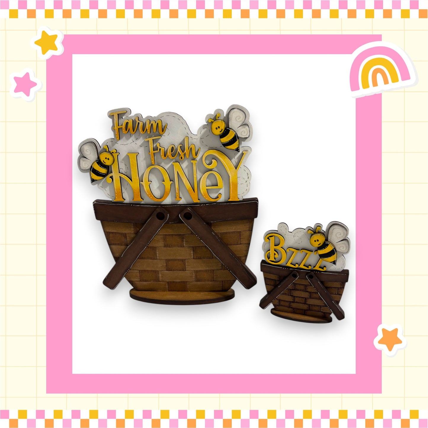 two wooden baskets, one larger and one smaller, both containing honeybees. The larger basket is positioned on the left side of the image, while the smaller one is on the right. The baskets are set against a pink and yellow checkered background, and there are small stars scattered around the image.