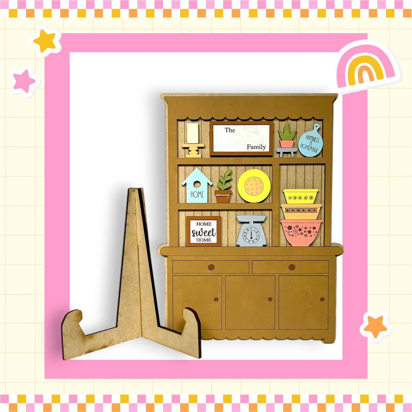 A wooden hutch with various knick-knacks and decorations, including a sign that says "The Family" and a rainbow-colored frame.