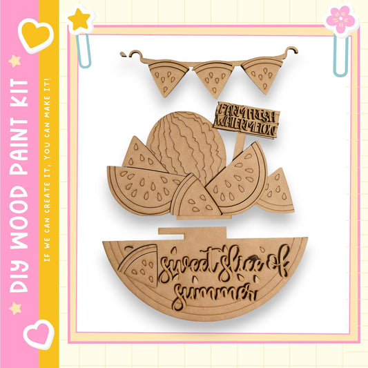 The image is a wooden paint kit featuring a design of a slice of watermelon and the text "Sweet Slice of Summer".